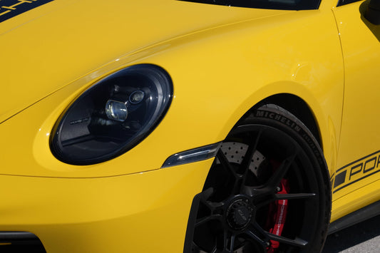 Yellow 2023 Porsche 911 GT3 parked in Marbella, available for rent from Prime Costa Rentals.
