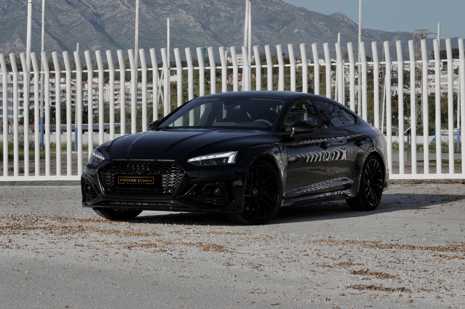 Black 2021 Audi RS 5 Sportback parked in Marbella, available for rent at Prime Costa Rentals.