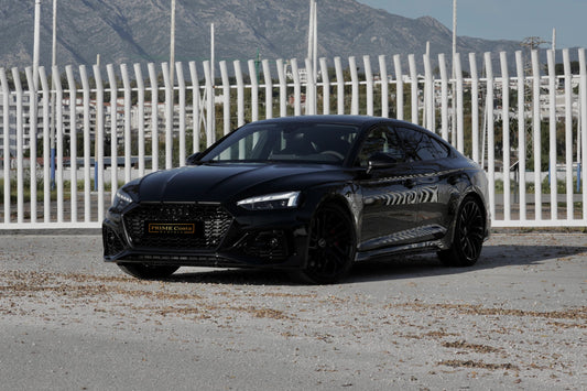 Black 2021 Audi RS 5 Sportback parked in Marbella, available for rent at Prime Costa Rentals.