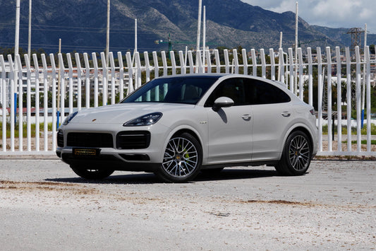 Grey 2023 Porsche Cayenne Coupe E-Hybrid SUV parked in Marbella, available for rent from Prime Costa Rentals.