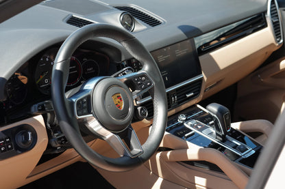 Grey 2023 Porsche Cayenne Coupe E-Hybrid SUV parked in Marbella, available for rent from Prime Costa Rentals.