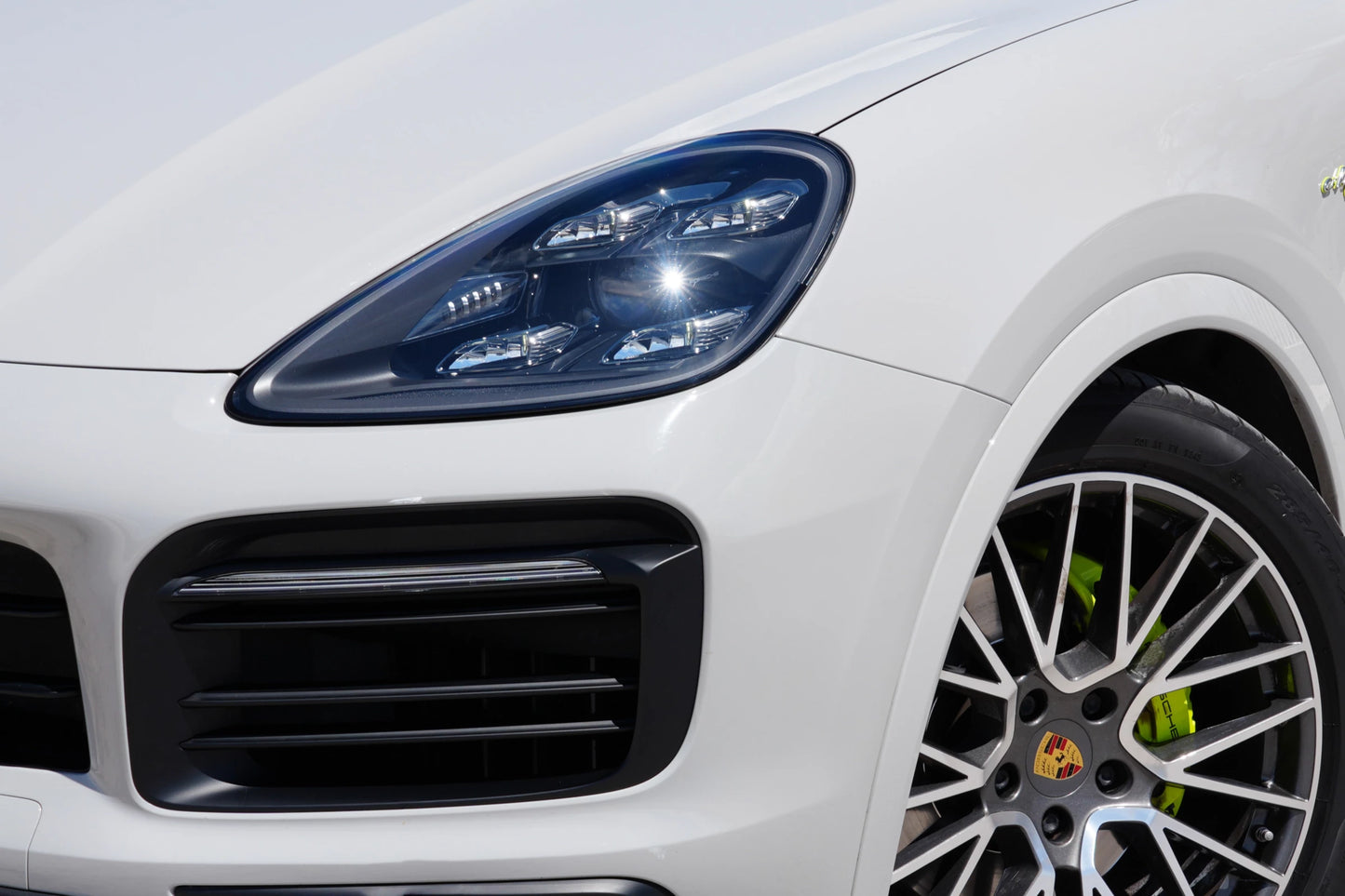 Grey 2023 Porsche Cayenne Coupe E-Hybrid SUV parked in Marbella, available for rent from Prime Costa Rentals.