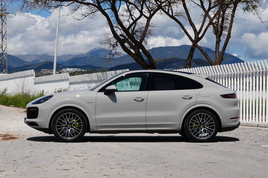 Grey 2023 Porsche Cayenne Coupe E-Hybrid SUV parked in Marbella, available for rent from Prime Costa Rentals.