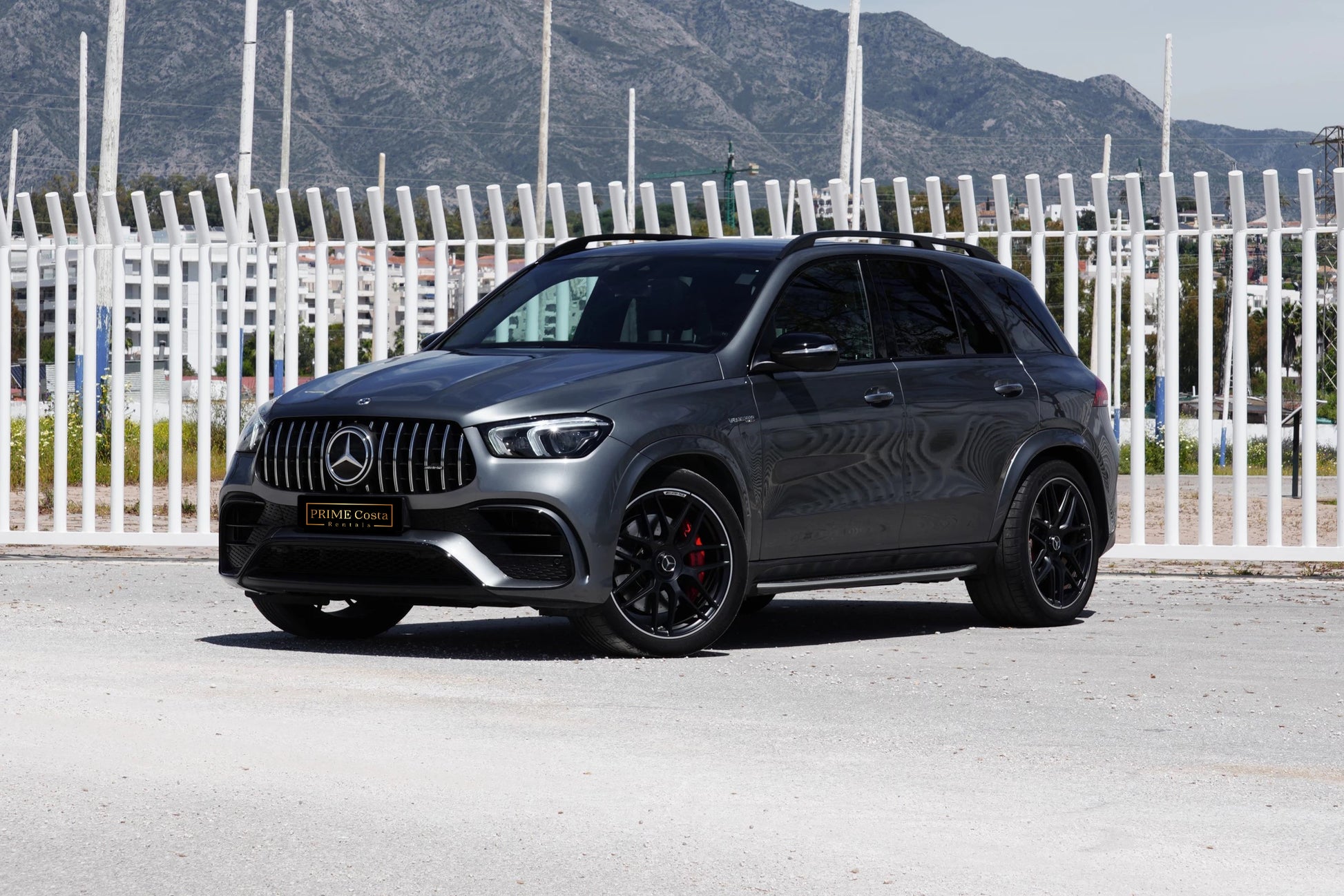 Grey 2022 Mercedes-AMG GLE 63 S SUV parked in Marbella, available for rent from Prime Costa Rentals.
