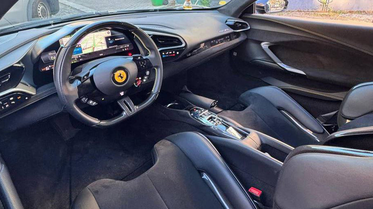 Ferrari 296 GTB black interior and dashboard with steering wheel