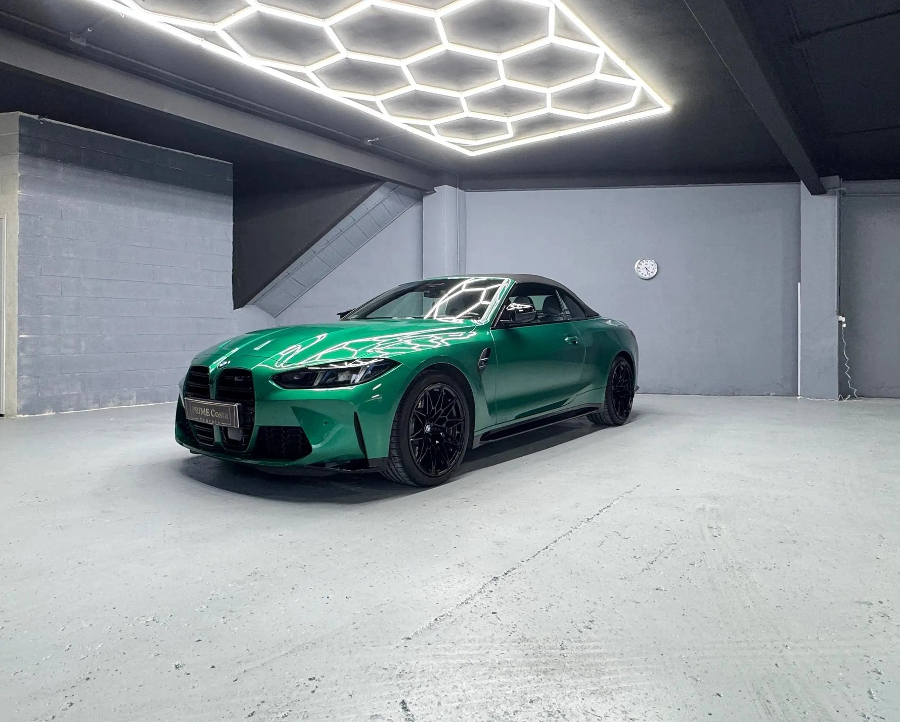 2025 Green BMW M4 Competition front left side view with roof closed