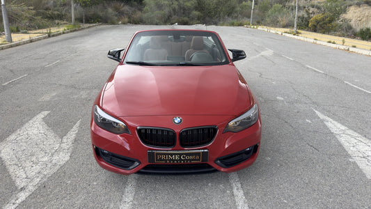BMW 2 Series Cabrio parked in Benidorm, available for rent with delivery across Spain.
