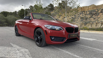 BMW 2 Series Cabrio parked in Benidorm, available for rent with delivery across Spain.

