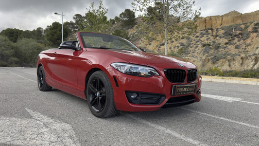 BMW 2 Series Cabrio parked in Benidorm, available for rent with delivery across Spain.
