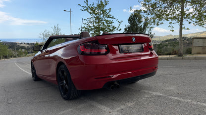 BMW 2 Series Cabrio parked in Benidorm, available for rent with delivery across Spain.
