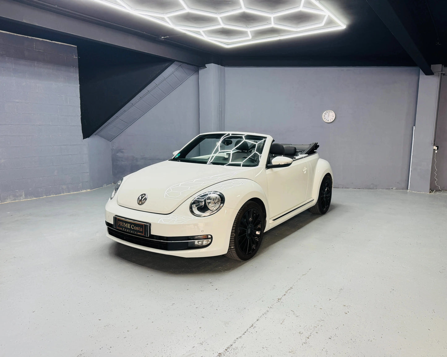 White VW Beetle Kafer Convertible front left side, pictured in garage with hexagon lightening