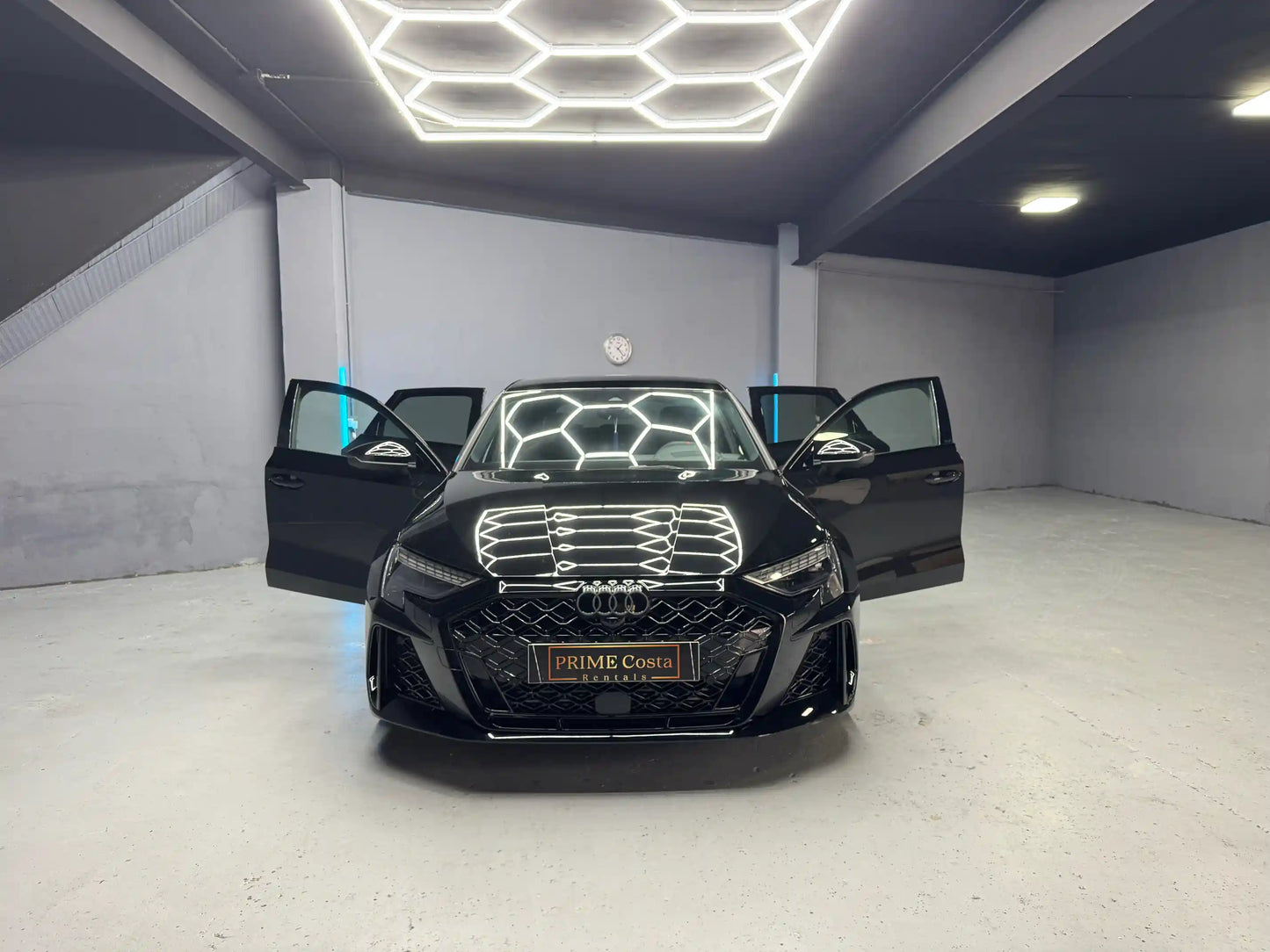 Audi RS3 2025 for rent Costa Blanca – aggressive sport styling with doors open ready to drive