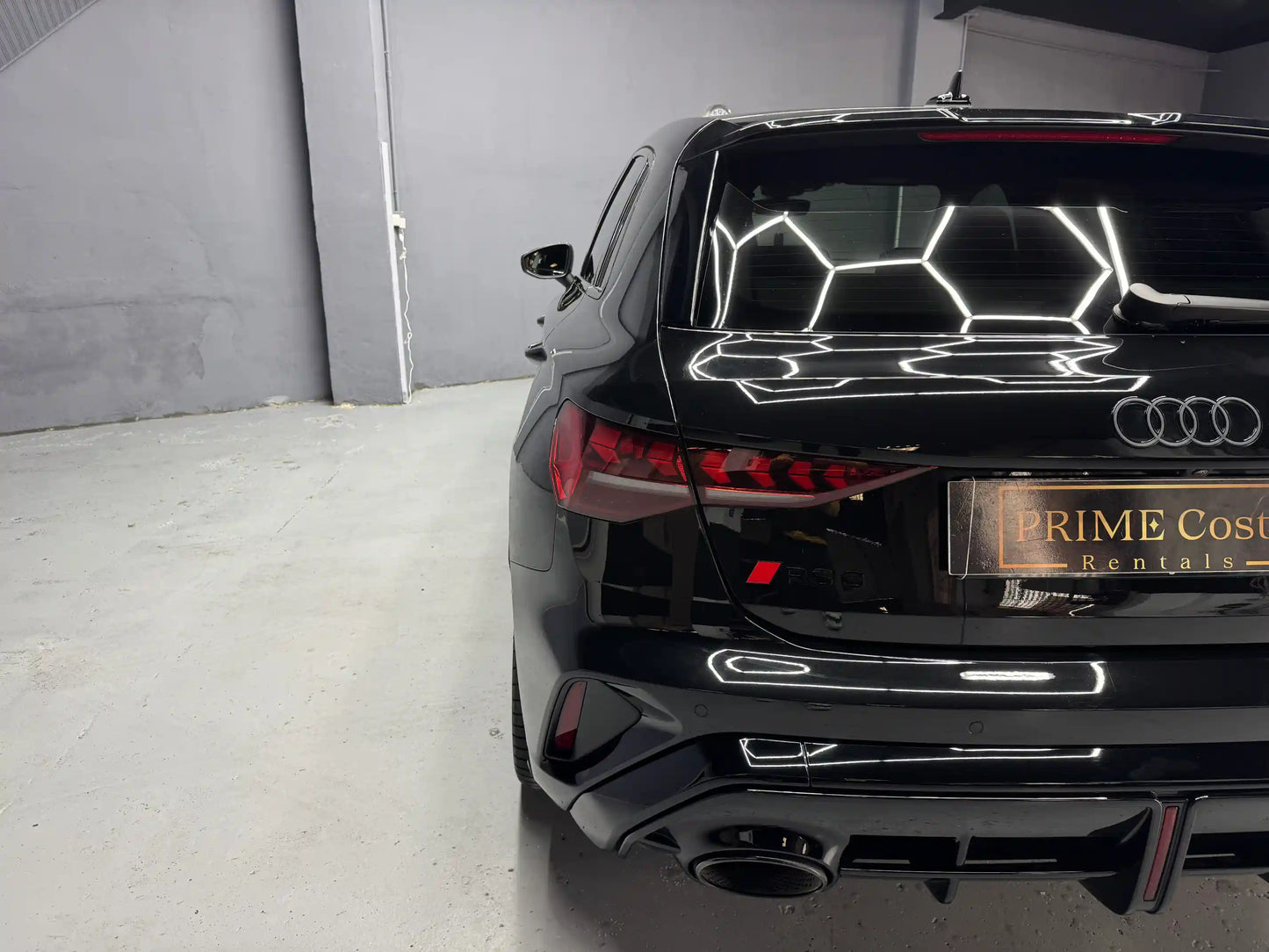 Audi RS3 2025 Turbo for rent in Benidorm – aggressive rear diffuser and RS performance badge