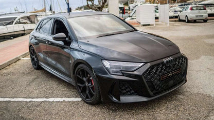 2025 Black Audi RS3 front right side near sea