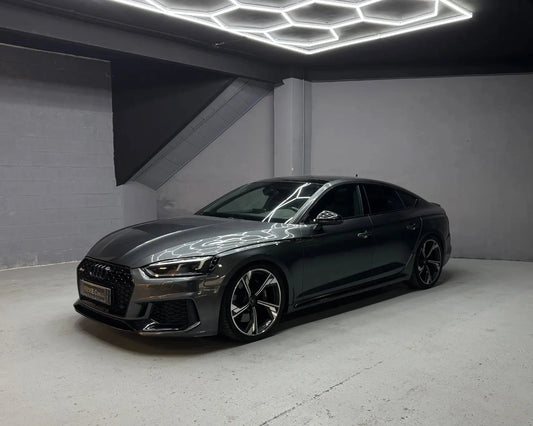 Audi RS5 Sportback in grey parked indoors available for luxury car hire in Alicante Costa Blanca