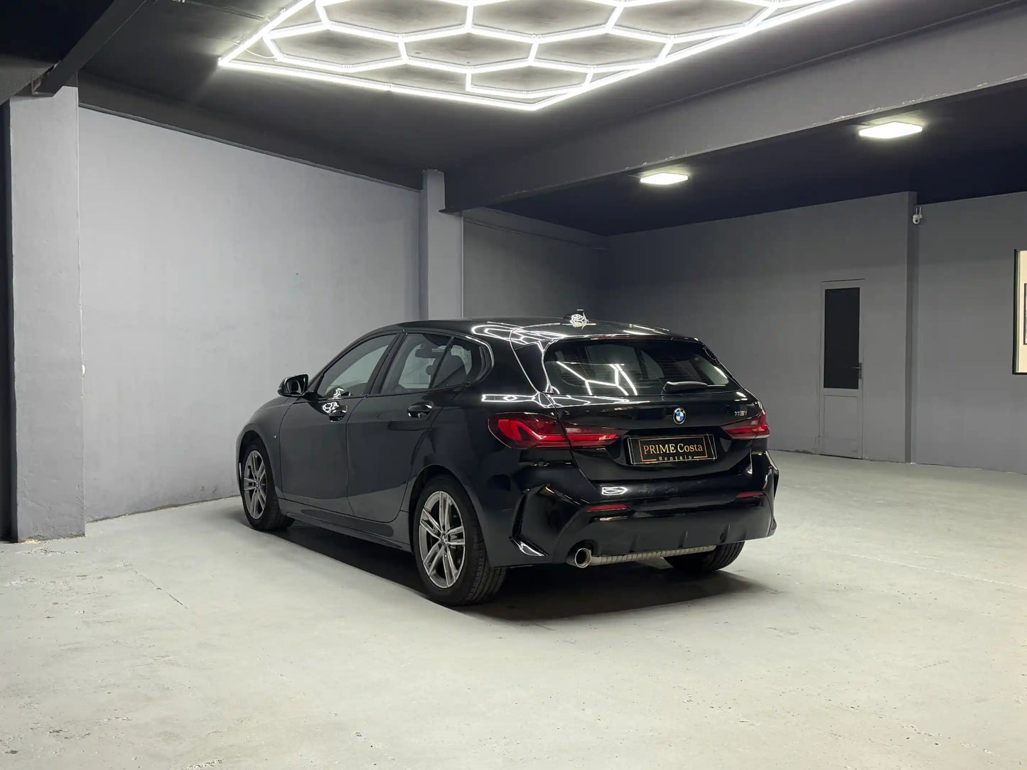 BMW 118i M Pack for rent in Benidorm – premium hatchback rear view at Prime Costa garage