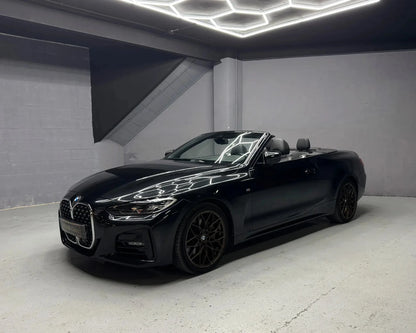BMW 430i convertible parked indoors available for hire in Benidorm