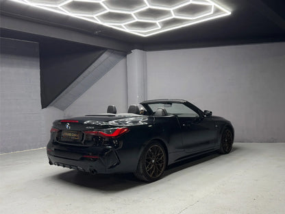 Rear side view of BMW 430i convertible luxury rental car in Costa Blanca