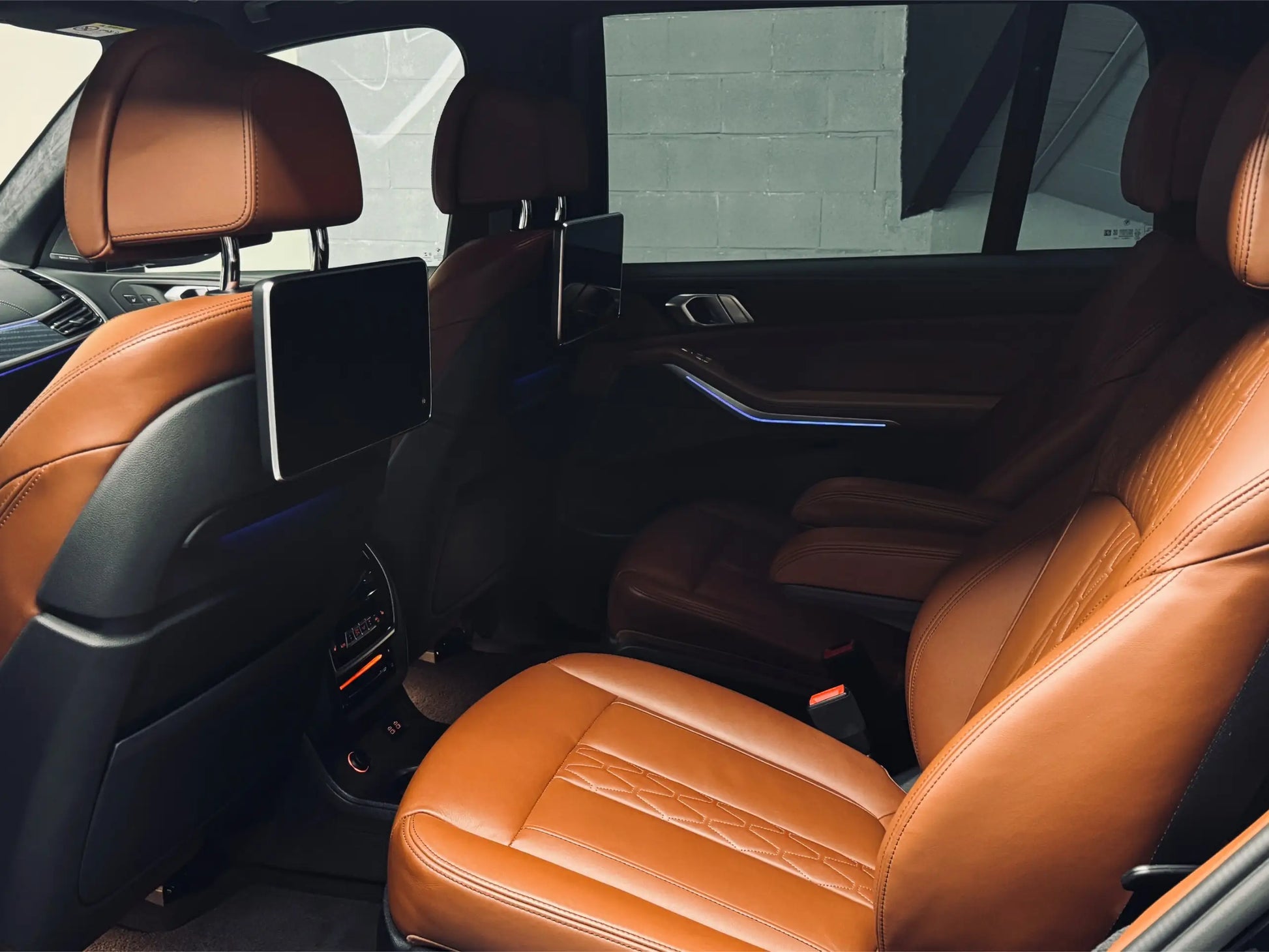 BMW X7 rear entertainment screens luxury SUV rental Alicante airport delivery