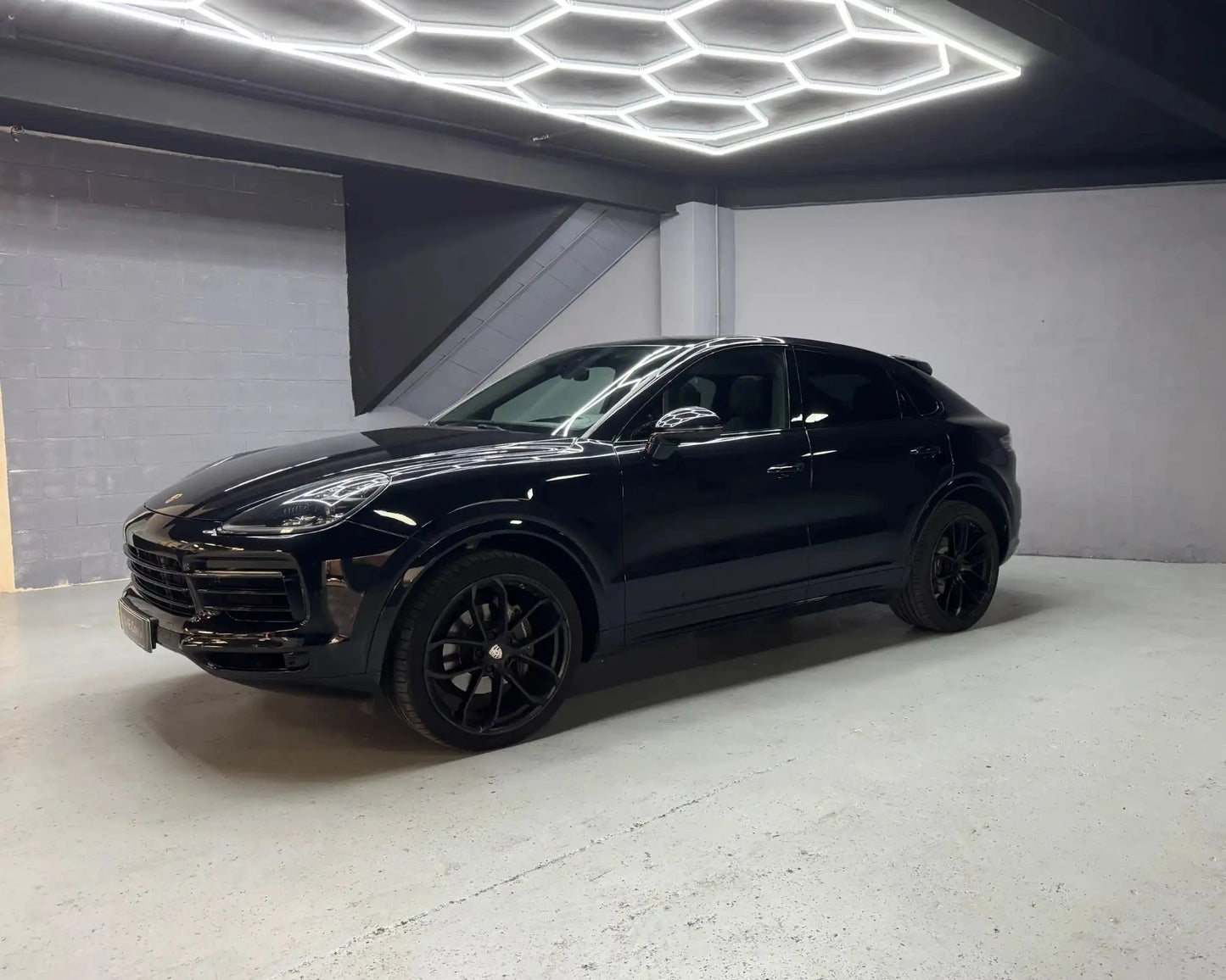 Porsche Cayenne black SUV side front view available for rent