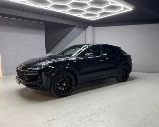 Porsche Cayenne black SUV side front view available for rent