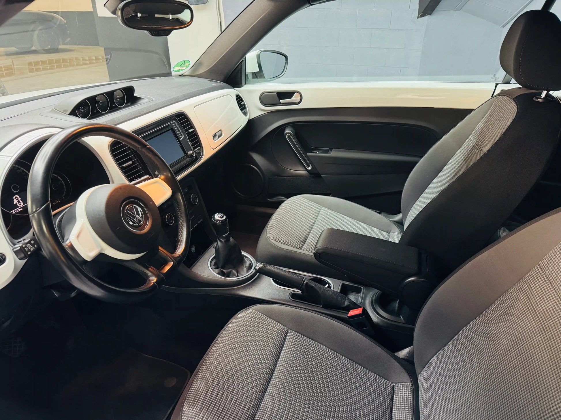 VW Beetle Kafer black interior view with visible dashboard and steering wheel
