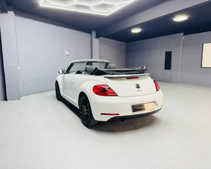 White VW Beetle Kafer Convertible with rood down in empty garage